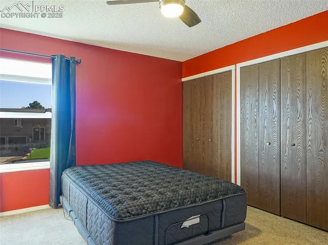 a bedroom with a sink and a mirror