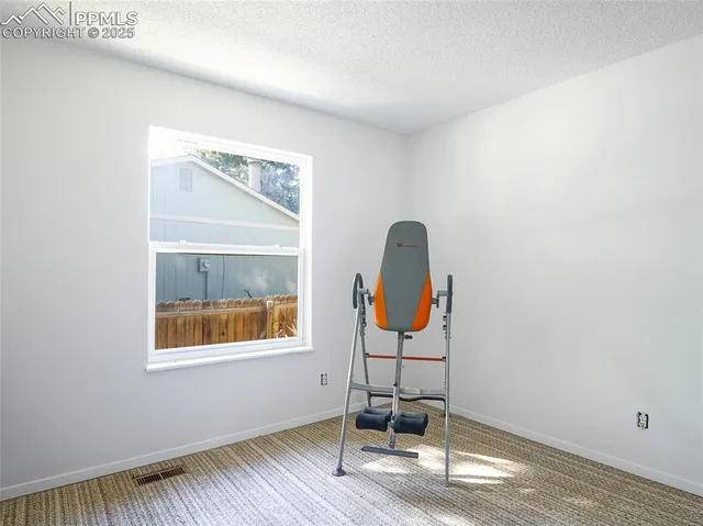 a room with furniture and view of a window