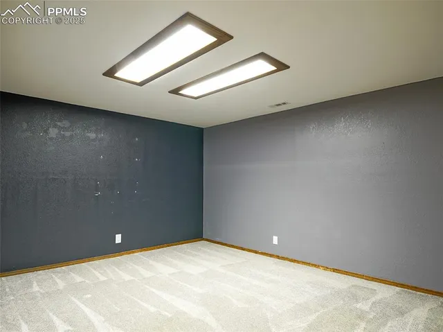 a bathroom with a sink a toilet and shower curtain