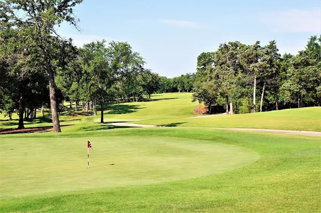 a view of a swimming pool with an outdoor space and seating area