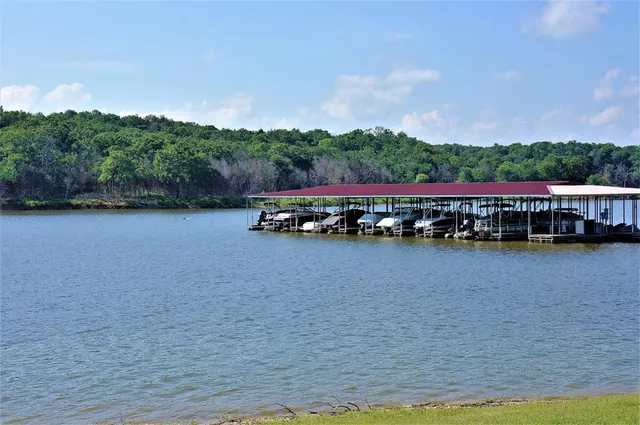 a view of a lake with houses in the background