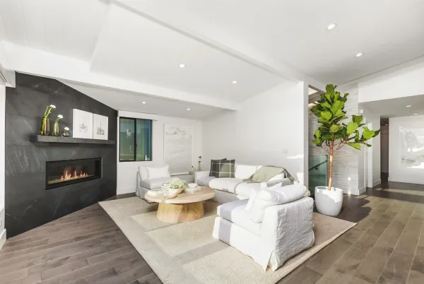 a living room with furniture fireplace and a fireplace