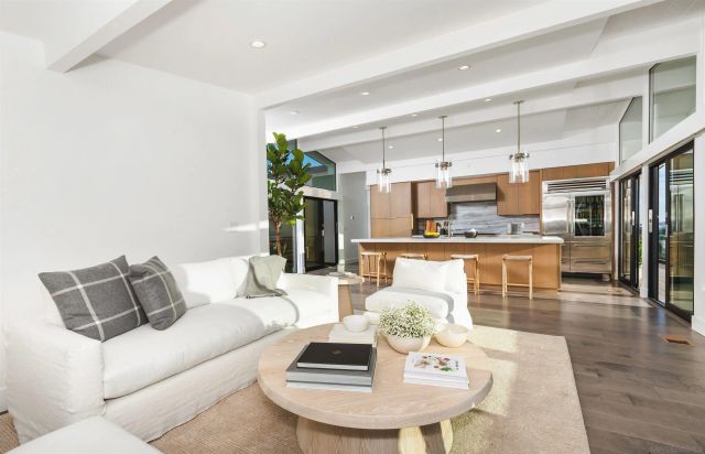 a living room with furniture and a table