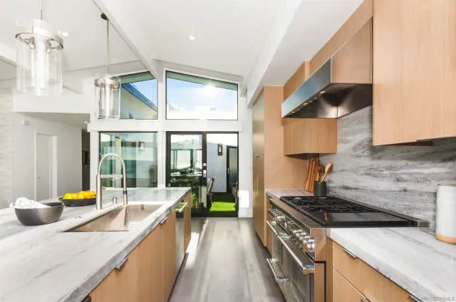 a living room with a table and chairs