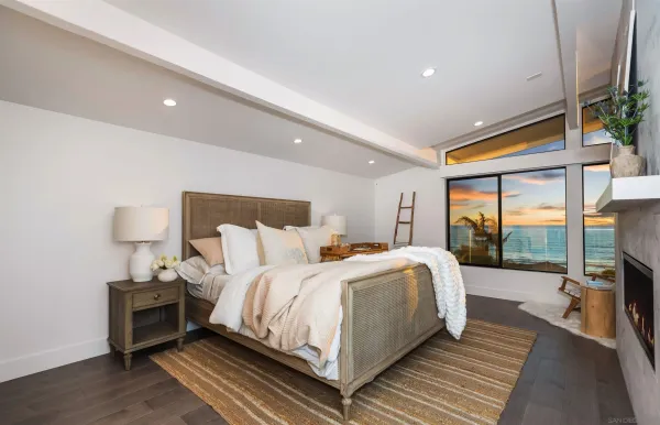 a bed room with a bed and a large window
