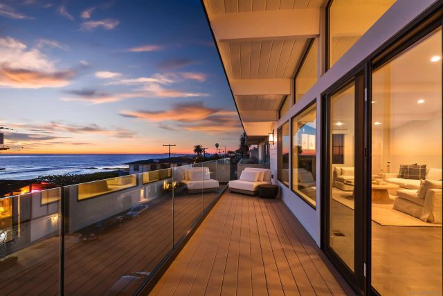 a view of an entryway with wooden floor and a front door