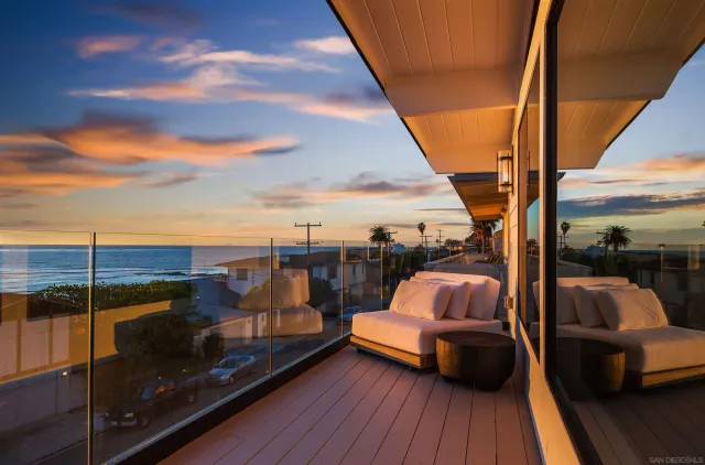 a bathroom with a granite countertop sink and a toilet