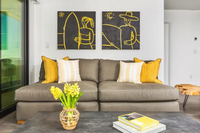 a living room with furniture and wooden floor