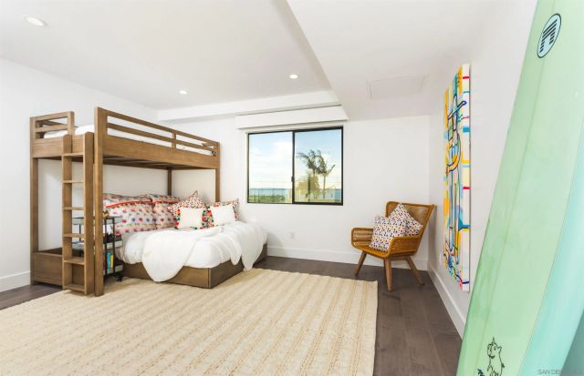 a view of a terrace with lawn chairs