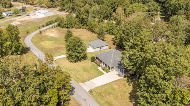 a view of a swimming pool with a yard