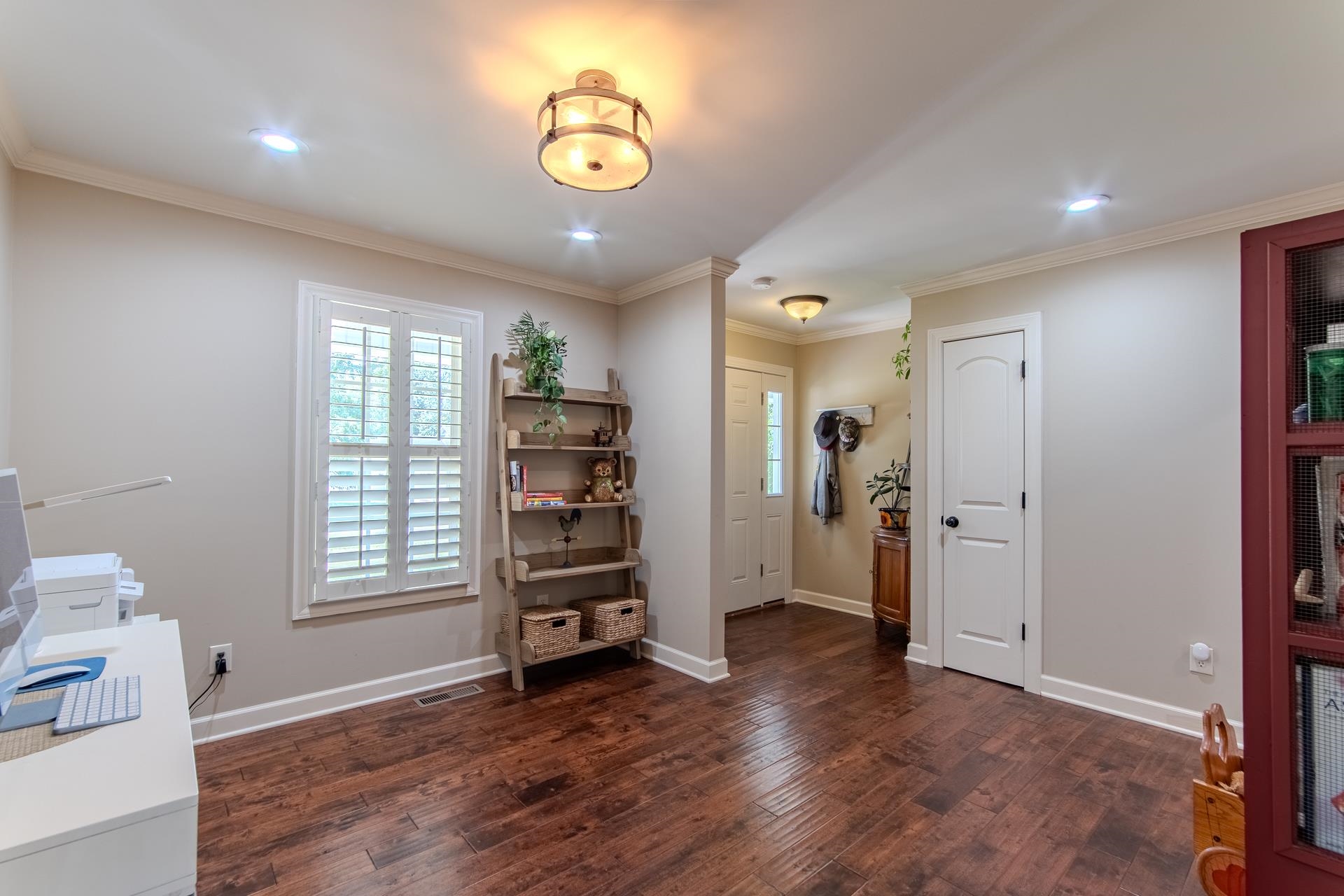 115 Partridge Lane Savannah, TN 38372 - Photo 24 of 40 an empty room with wooden floor and windows