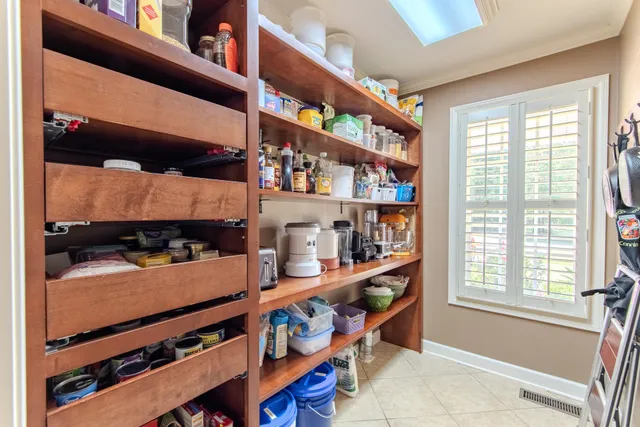 a room with lots of furniture and a window