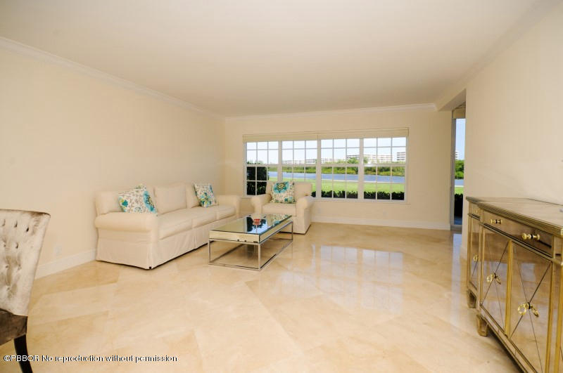2185 Ibis Isle Road, Unit 2 Palm Beach, FL 33480 - Photo 2 of 26 a living room with furniture and a large window