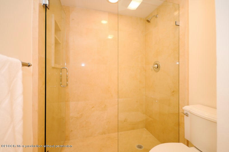 2185 Ibis Isle Road, Unit 2 Palm Beach, FL 33480 - Photo 15 of 26 a bathroom with a shower and a toilet