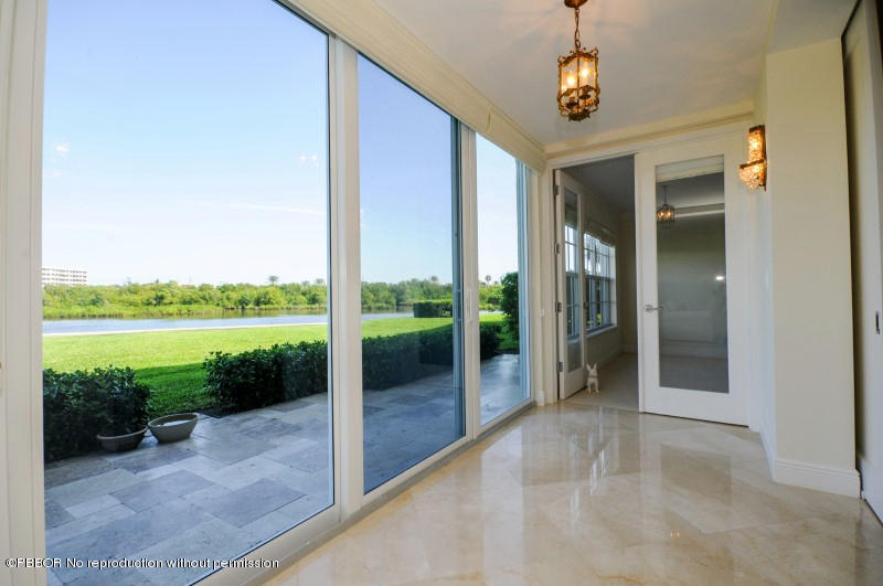 2185 Ibis Isle Road, Unit 2 Palm Beach, FL 33480 - Photo 18 of 26 a view of a porch and garden