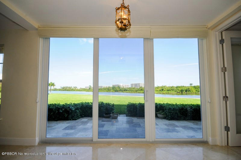 2185 Ibis Isle Road, Unit 2 Palm Beach, FL 33480 - Photo 19 of 26 a view of a glass door and porch