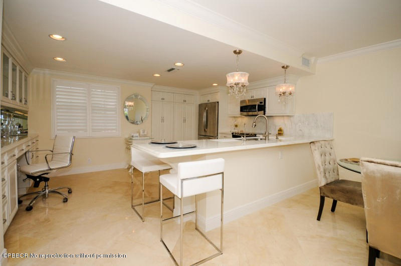 2185 Ibis Isle Road, Unit 2 Palm Beach, FL 33480 - Photo 5 of 26 a kitchen with a sink cabinets and window