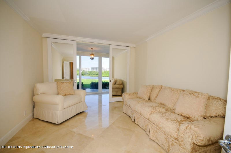 2185 Ibis Isle Road, Unit 2 Palm Beach, FL 33480 - Photo 10 of 26 a living room with furniture and a large window