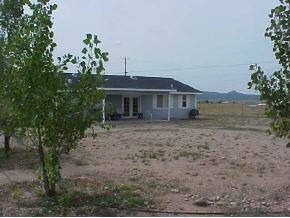 850 West Iris Road, Unit 4 Paulden, AZ 86334 - Photo 2 of 12 a front view of a house with a yard