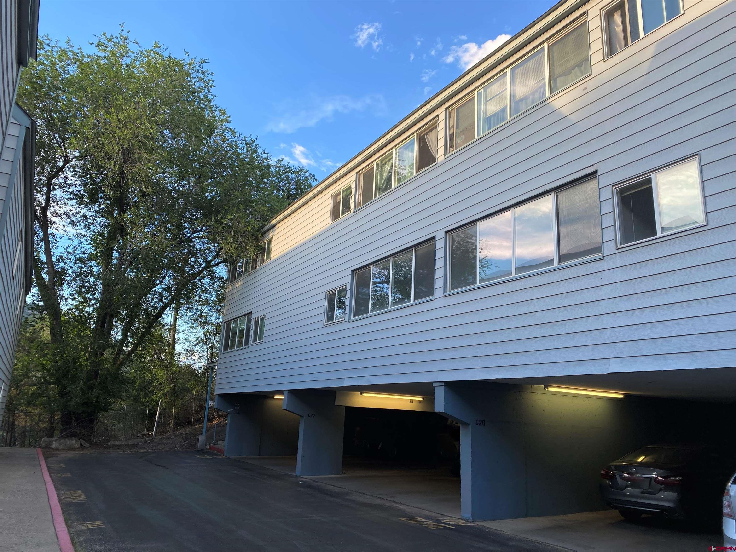 1135 Florida Road, Unit C7 Durango, CO 81301 - Photo 2 of 33 a front view of a house with parking