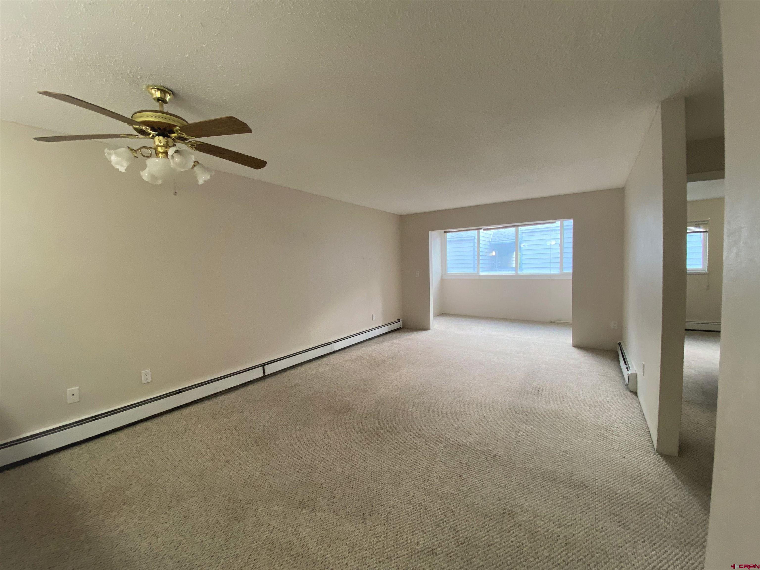 1135 Florida Road, Unit C7 Durango, CO 81301 - Photo 9 of 33 an empty room with a empty space and windows