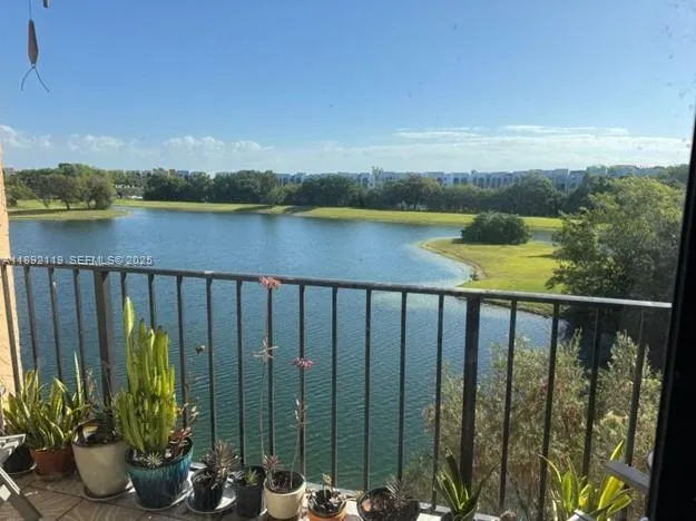 a view of a lake from a balcony with outdoor space