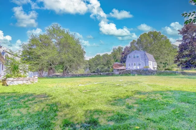 a backyard of a house with lots of green space