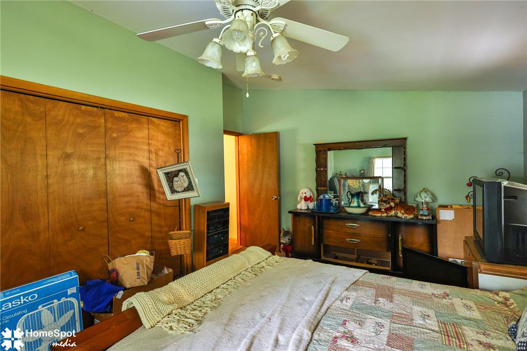 3795 Rhoades Road Kempton, PA 19529 - Photo 22 of 42 Functional sleeping space with a full-height closet and convenient ceiling fan for comfort.
