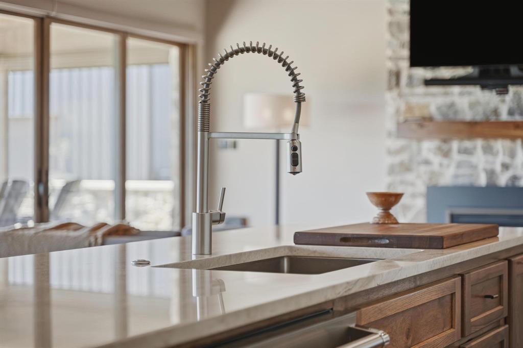 483 County Road 353 Merkel, TX 79536 - Photo 15 of 40 a kitchen with a sink and a wooden floor