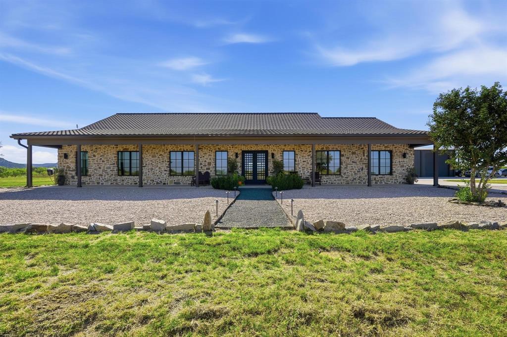483 County Road 353 Merkel, TX 79536 - Photo 2 of 40 a front view of a house with a yard and potted plants