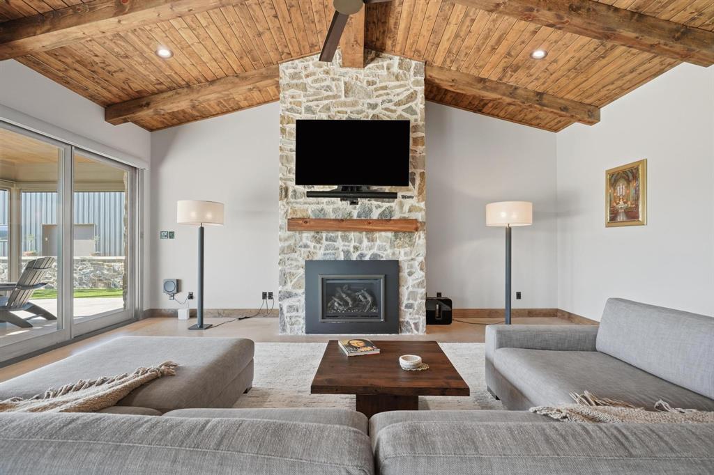 483 County Road 353 Merkel, TX 79536 - Photo 7 of 40 a living room with furniture a flat screen tv and a fireplace