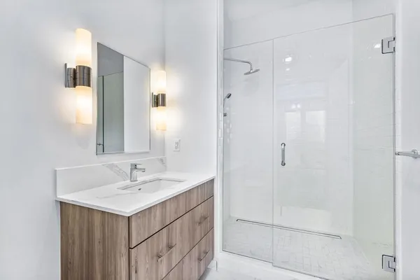 a bathroom with a sink and mirror