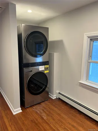 a view of a hallway with washer and dryer