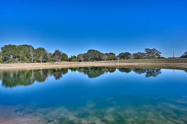 a view of a lake with a big yard