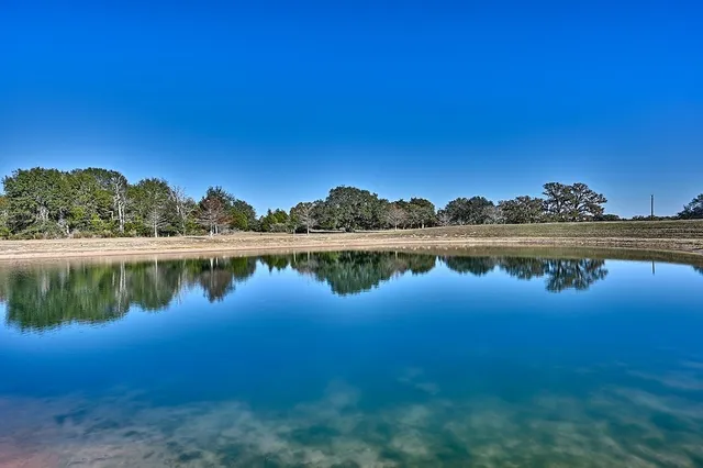 a view of a lake with a big yard