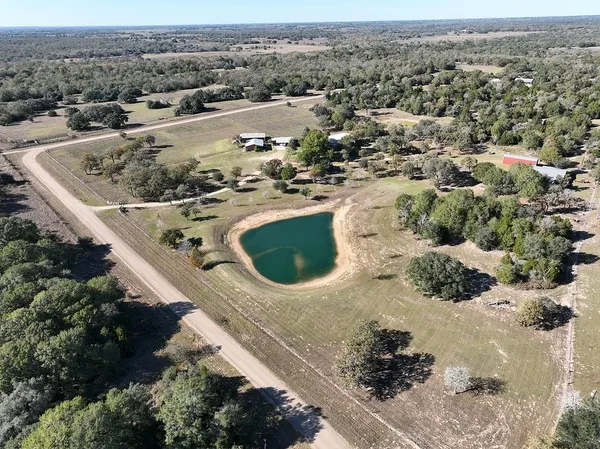 an aerial view of residential house with outdoor space