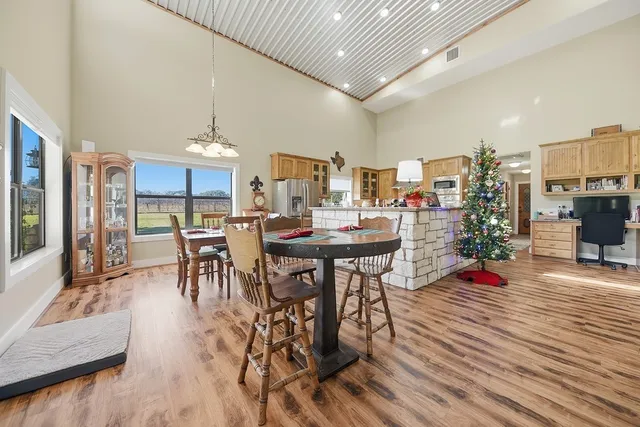 a view of a dining room with furniture and wooden floor