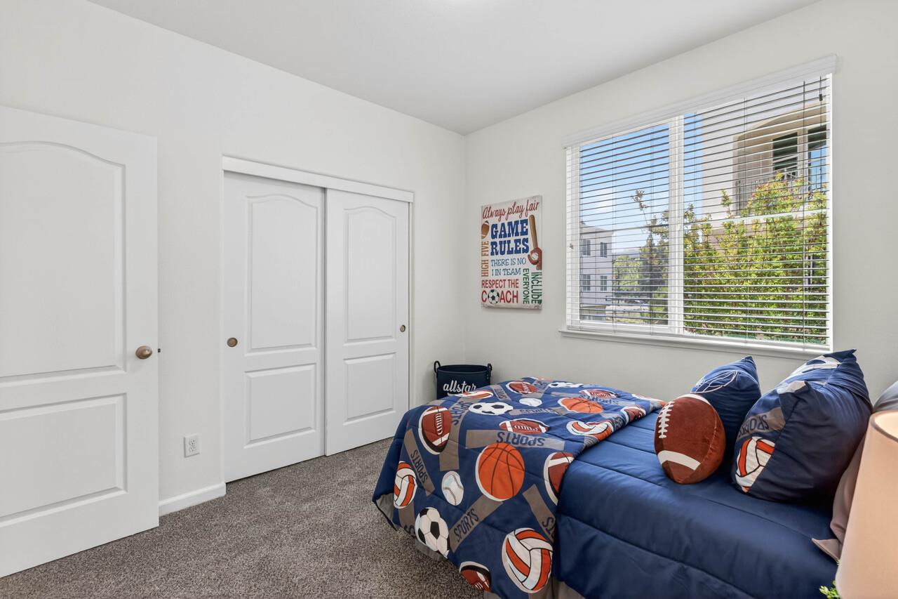4712 Norris Canyon Road, Unit 104 San Ramon, CA 94583 - Photo 14 of 22 a bedroom with bed and windows