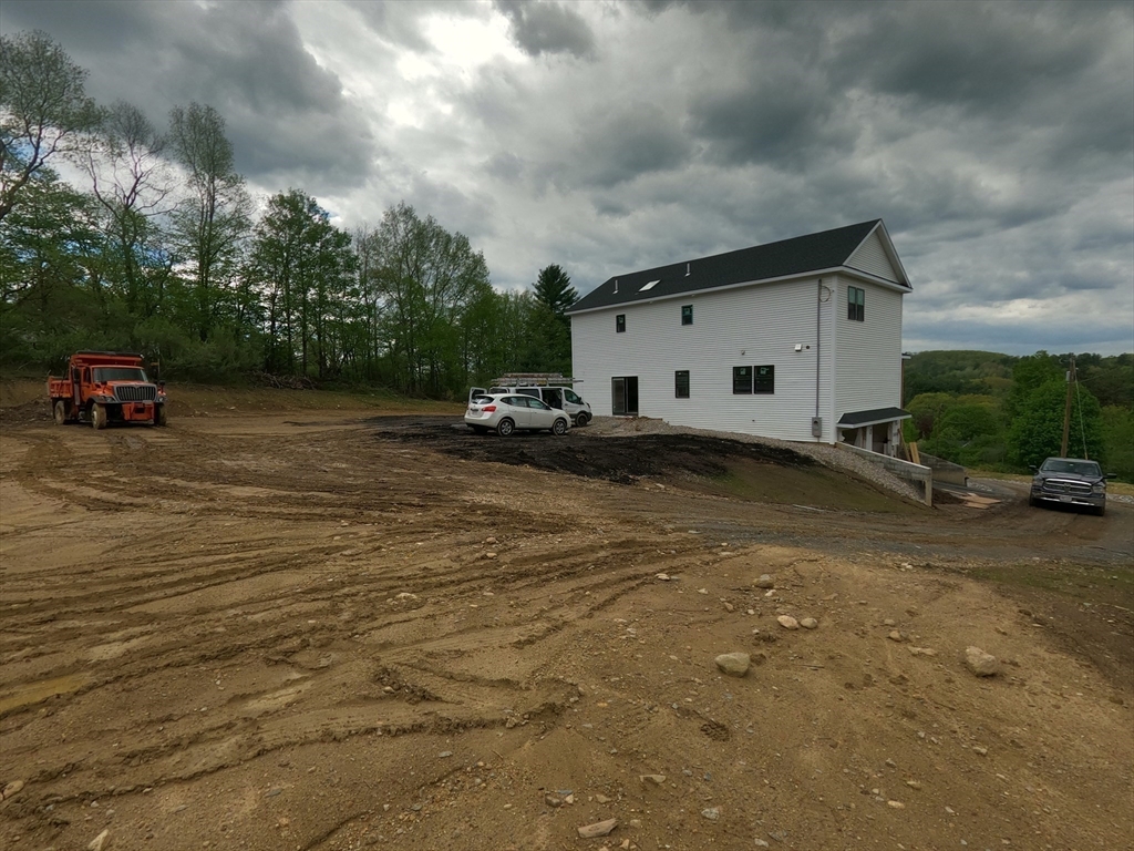 4 Eagleton Street Spencer, MA 01562 - Photo 11 of 11 a view of a house with a patio