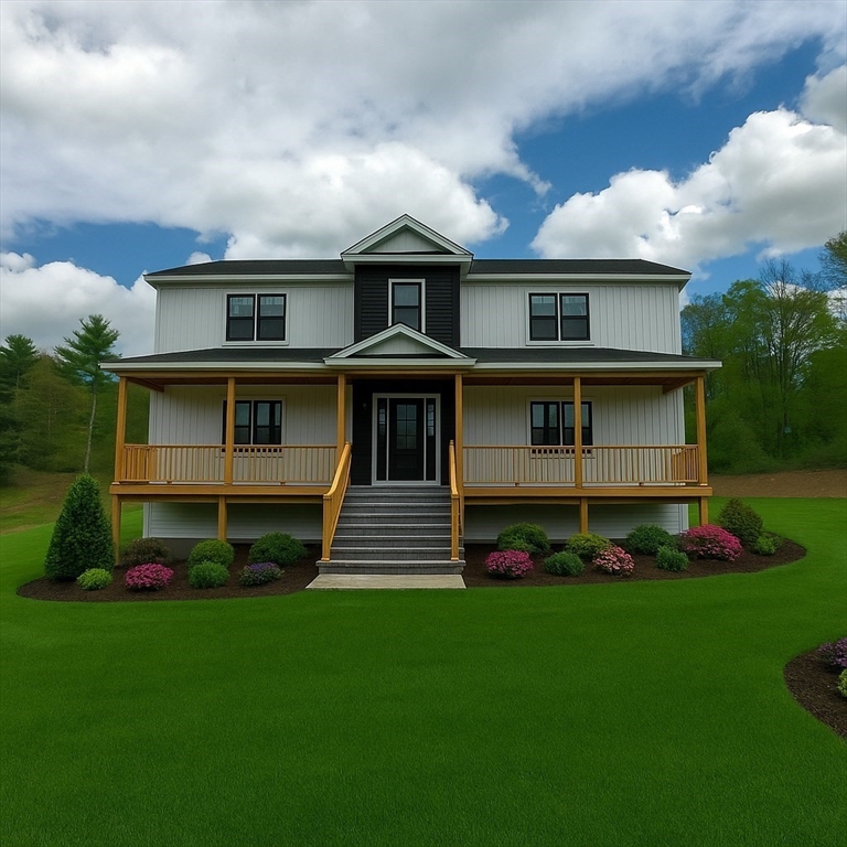 4 Eagleton Street Spencer, MA 01562 - Photo 3 of 11 a front view of a house with a yard