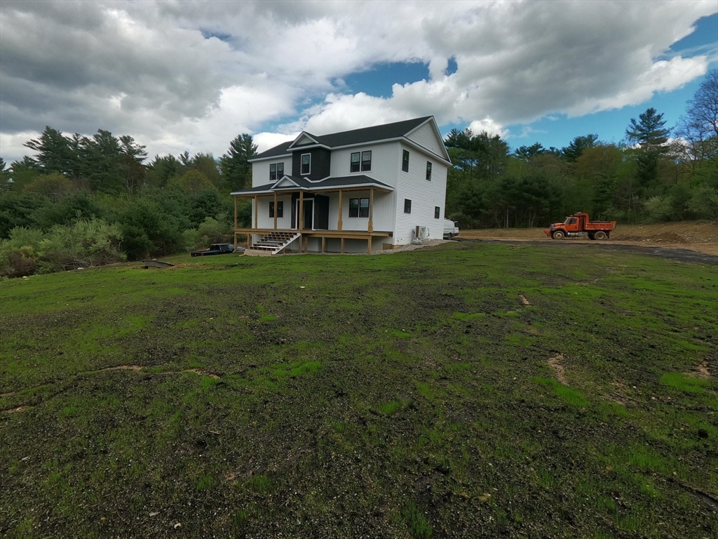 4 Eagleton Street Spencer, MA 01562 - Photo 10 of 11 a front view of a house with a yard