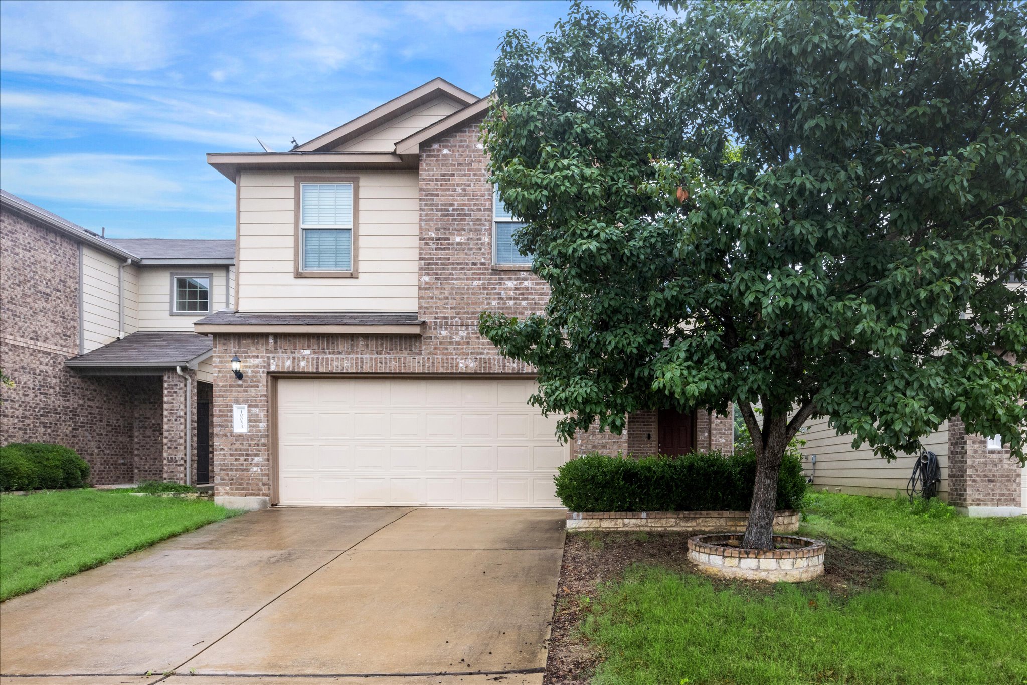 10053 Aly May Drive Austin, TX 78748 - Photo 15 of 15 a front view of a house with a garden and tree