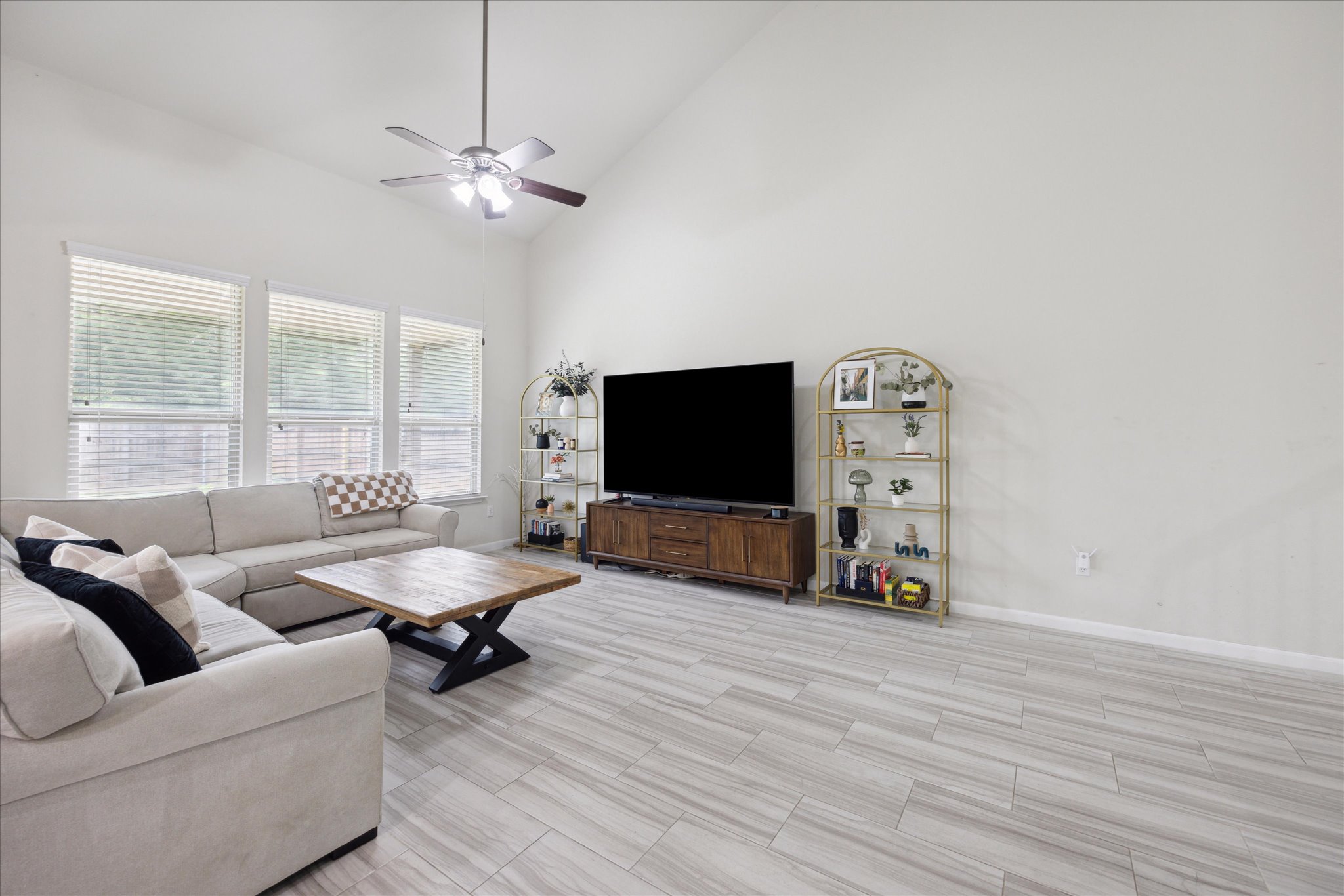10053 Aly May Drive Austin, TX 78748 - Photo 5 of 15 a living room with furniture and a flat screen tv