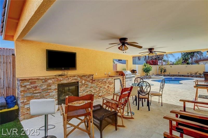 2410 Doherty Way Henderson, NV 89014 - Photo 58 of 63 View of patio with area for grilling, a fenced backyard, ceiling fan, and a grill