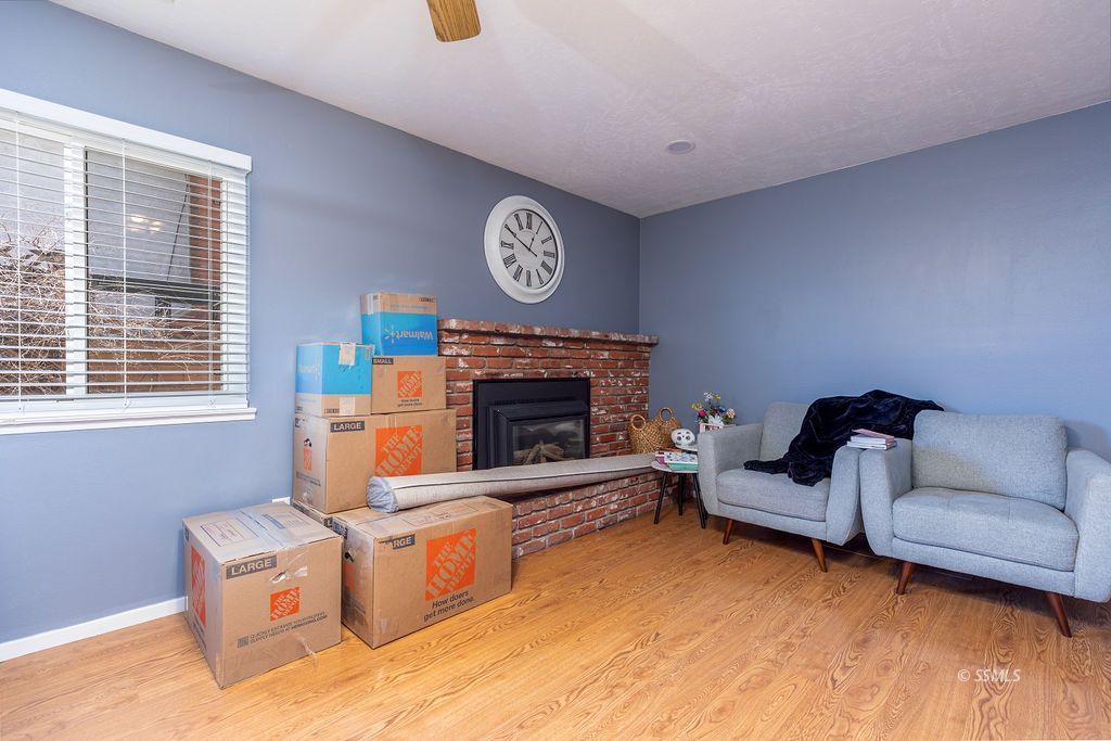 328 Peg Street Ridgecrest, CA 93555 - Photo 9 of 20 a living room with furniture and a fireplace