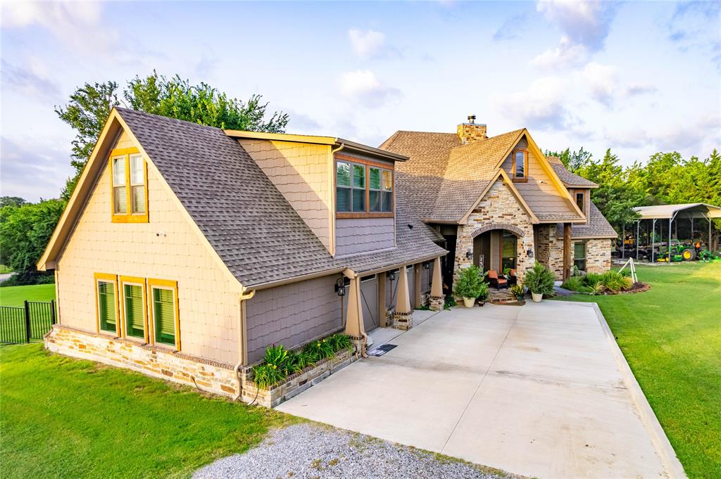 3300 Rigsby Lane Celina, TX 75009 - Photo 2 of 40 Craftsman-style exterior featuring a stone facade, shingle siding, and a covered entry porch