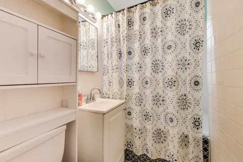 a view of a balcony with wooden floor