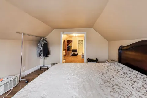 a white toilet sitting next to a shower curtain