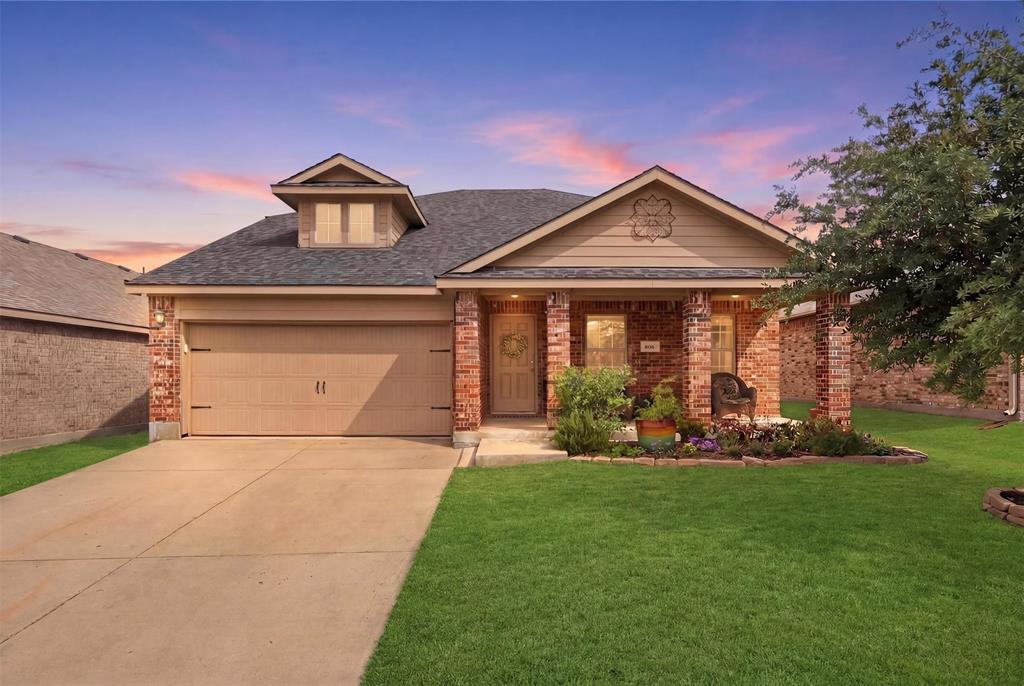 806 Silver Street Princeton, TX 75407 - Photo 1 of 29 Brick facade home featuring a covered porch with decorative columns, a dormer window, and an attached two-car garage