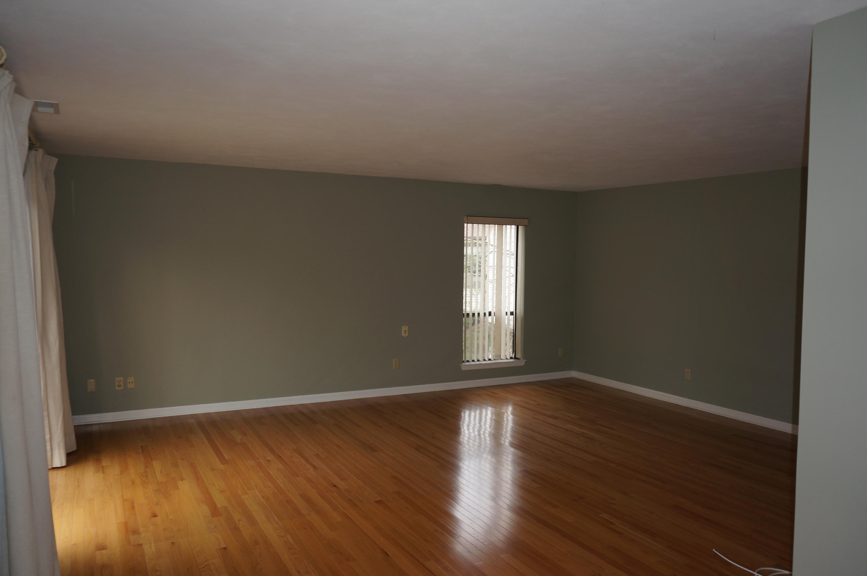 500 River Road, Unit 7 Greenwich, CT 06807 - Photo 15 of 29 a view of an empty room with wooden floor and window